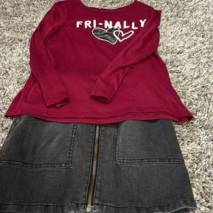 T-shirt and black jean zip up skirt.       Shirt brand - Justice. Skirt art clas
